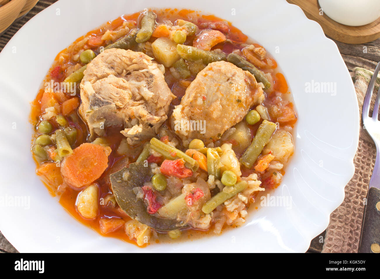 Chicken meat stew with vegetables and rice in plate Stock Photo - Alamy