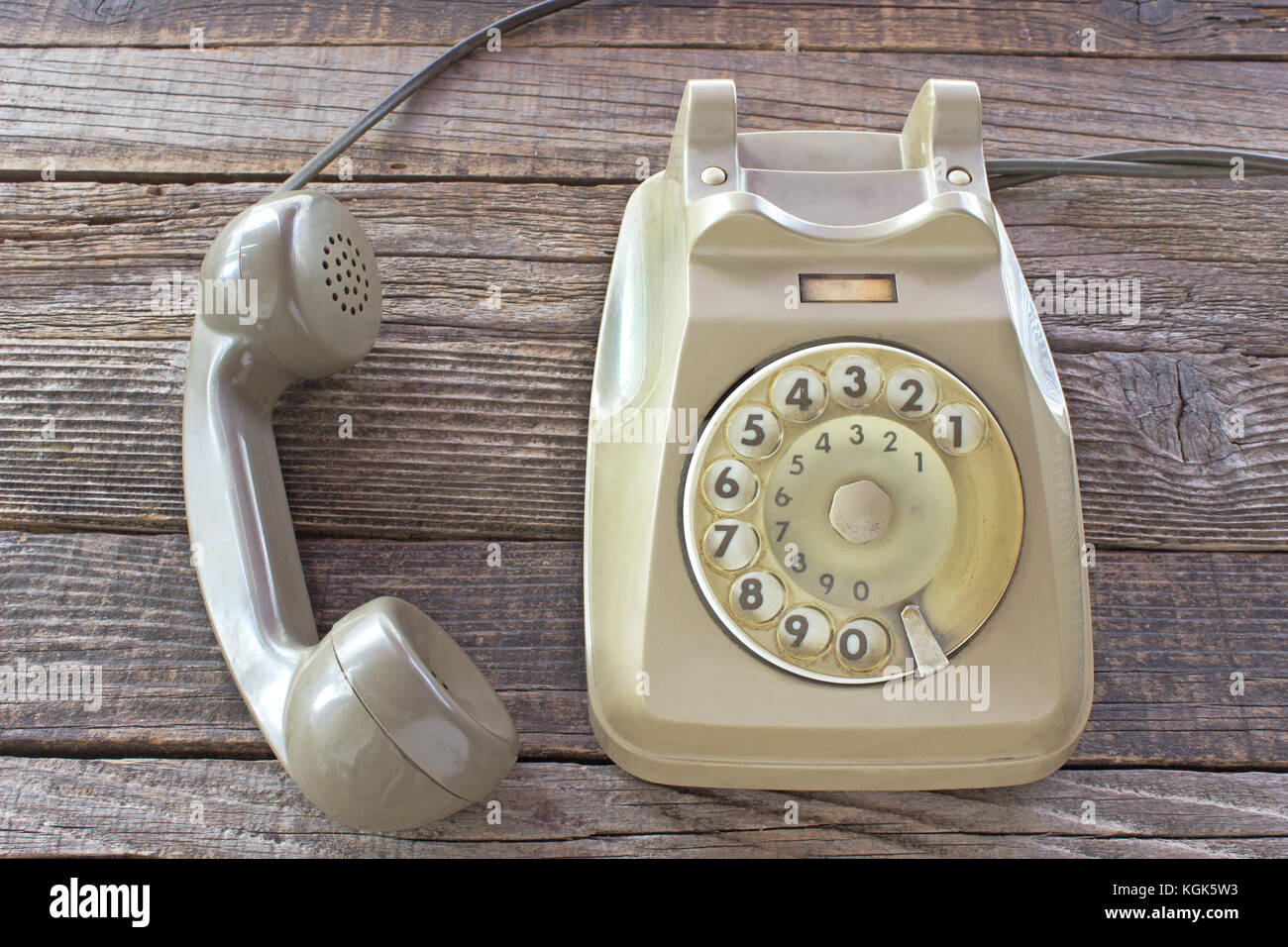 Old telephone on wooden background Stock Photo