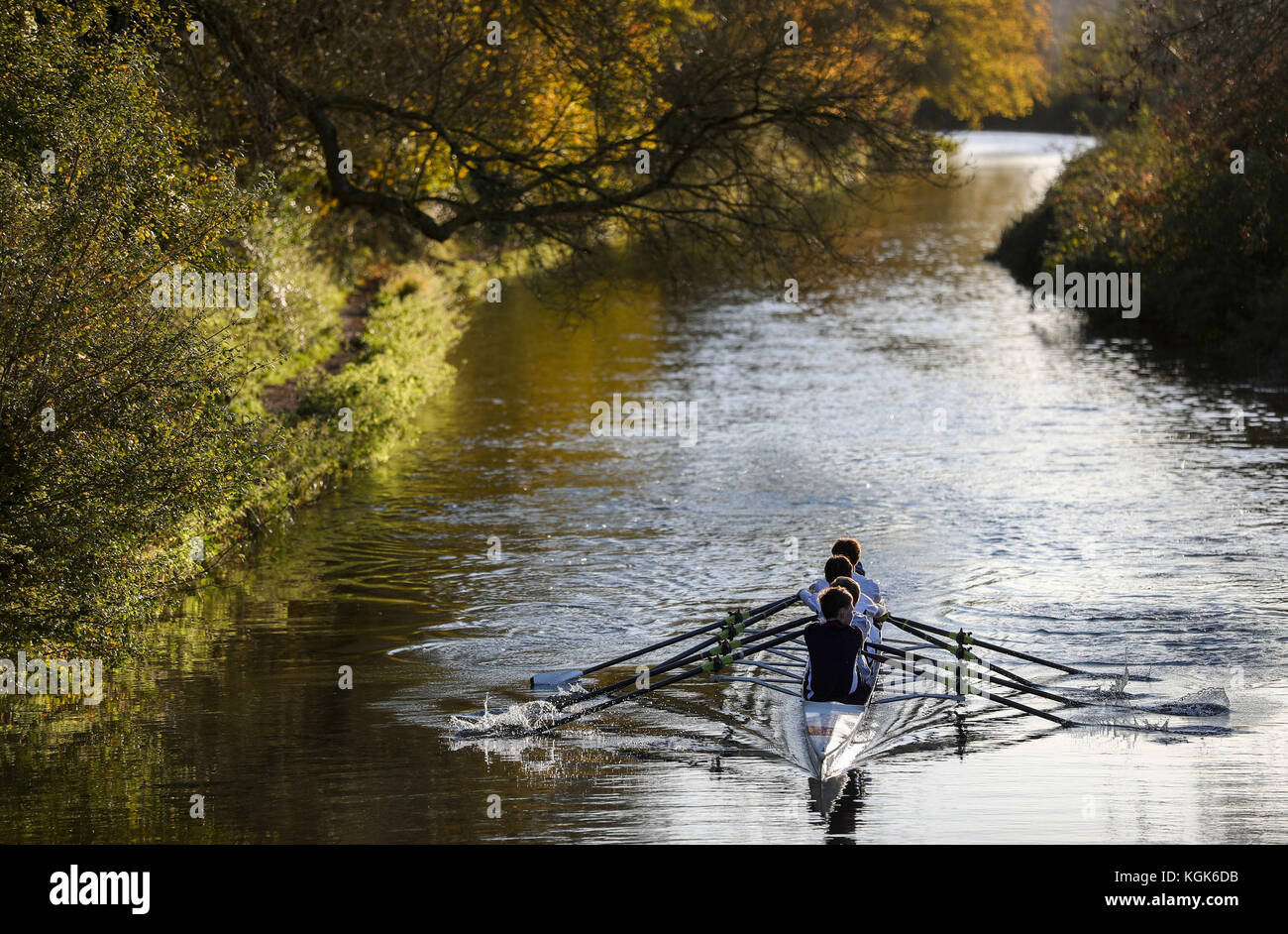 Rowers from the Winchester College Rowing club make their way along the Itchen Navigation in Winchester. Stock Photo