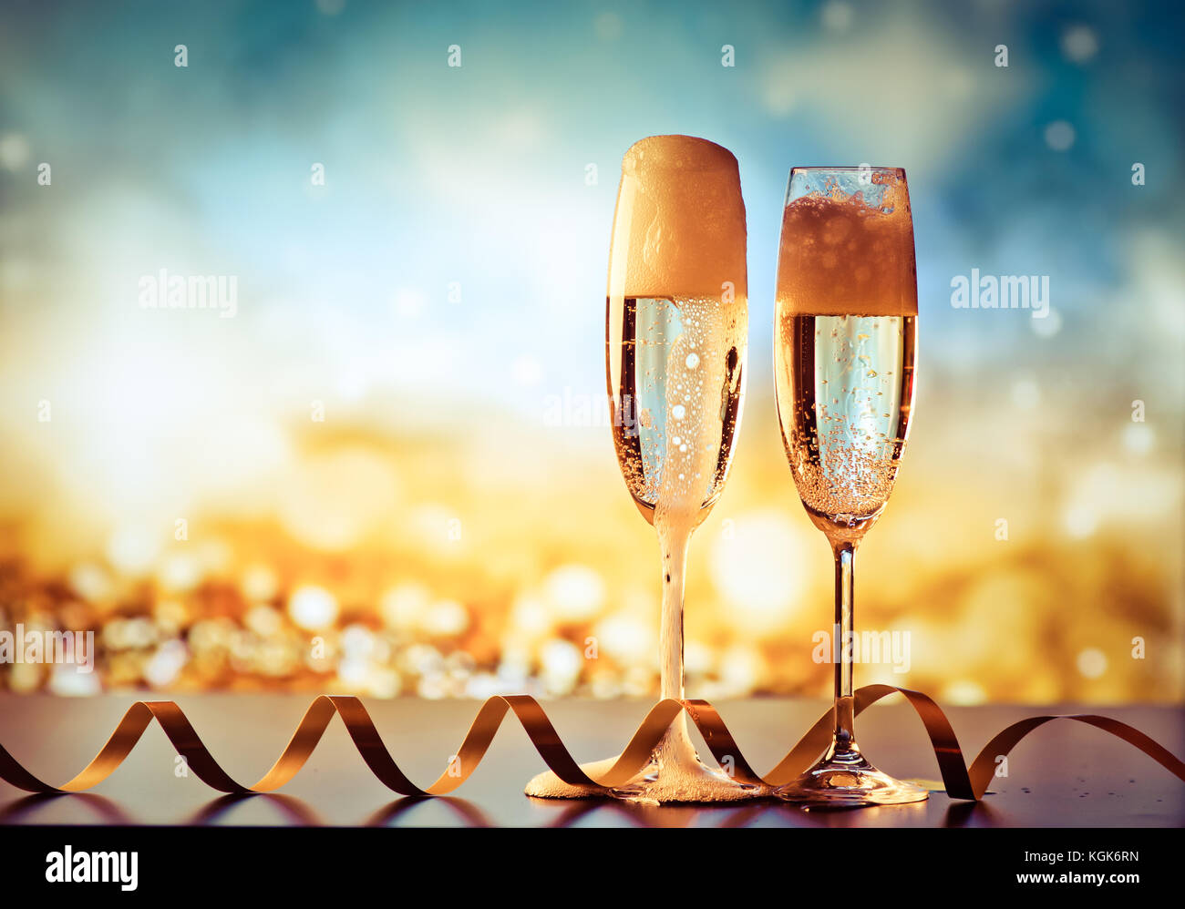 two champagne glasses ready to bring in the New Year Stock Photo - Alamy