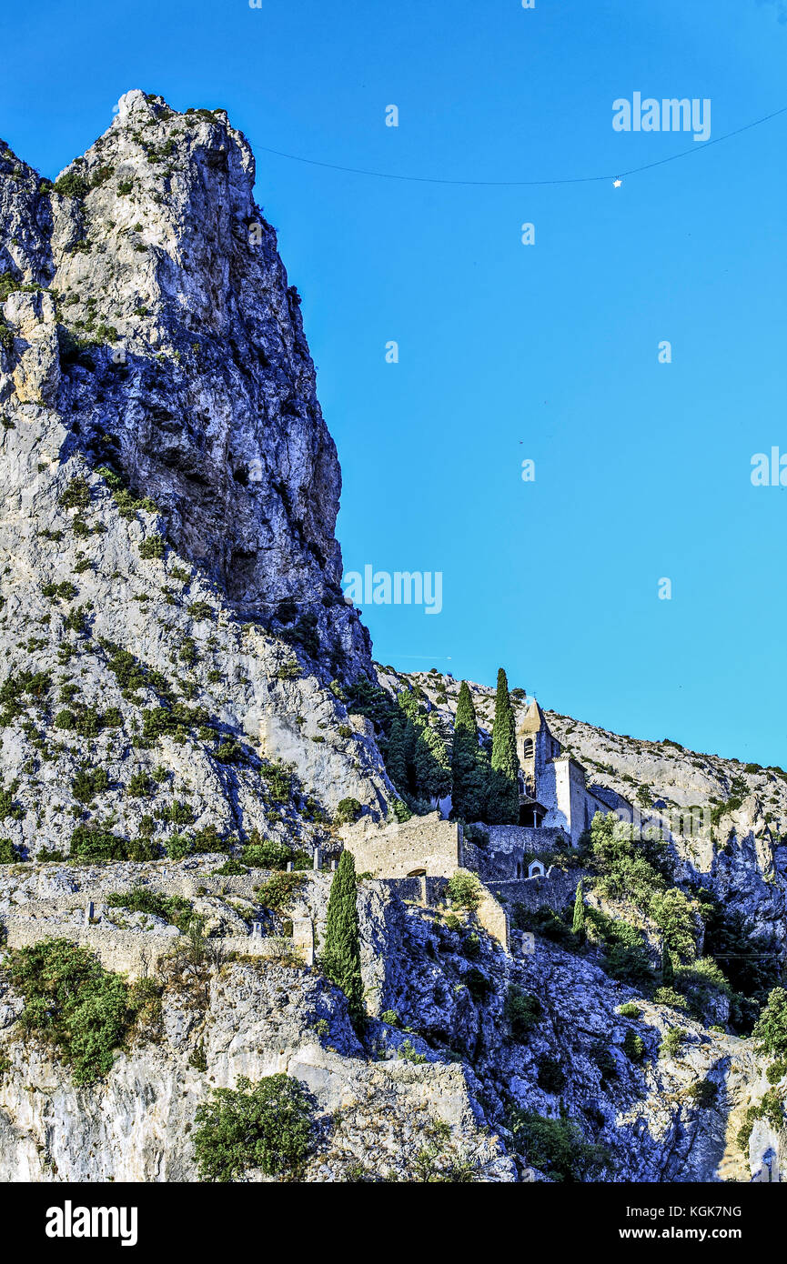 Europe, France, Alpes-de-Haute-Provence, Regional Natural Park of Verdon. Moustiers-Sainte-Marie, labeled The Most Beautiful Villages of France. The c Stock Photo
