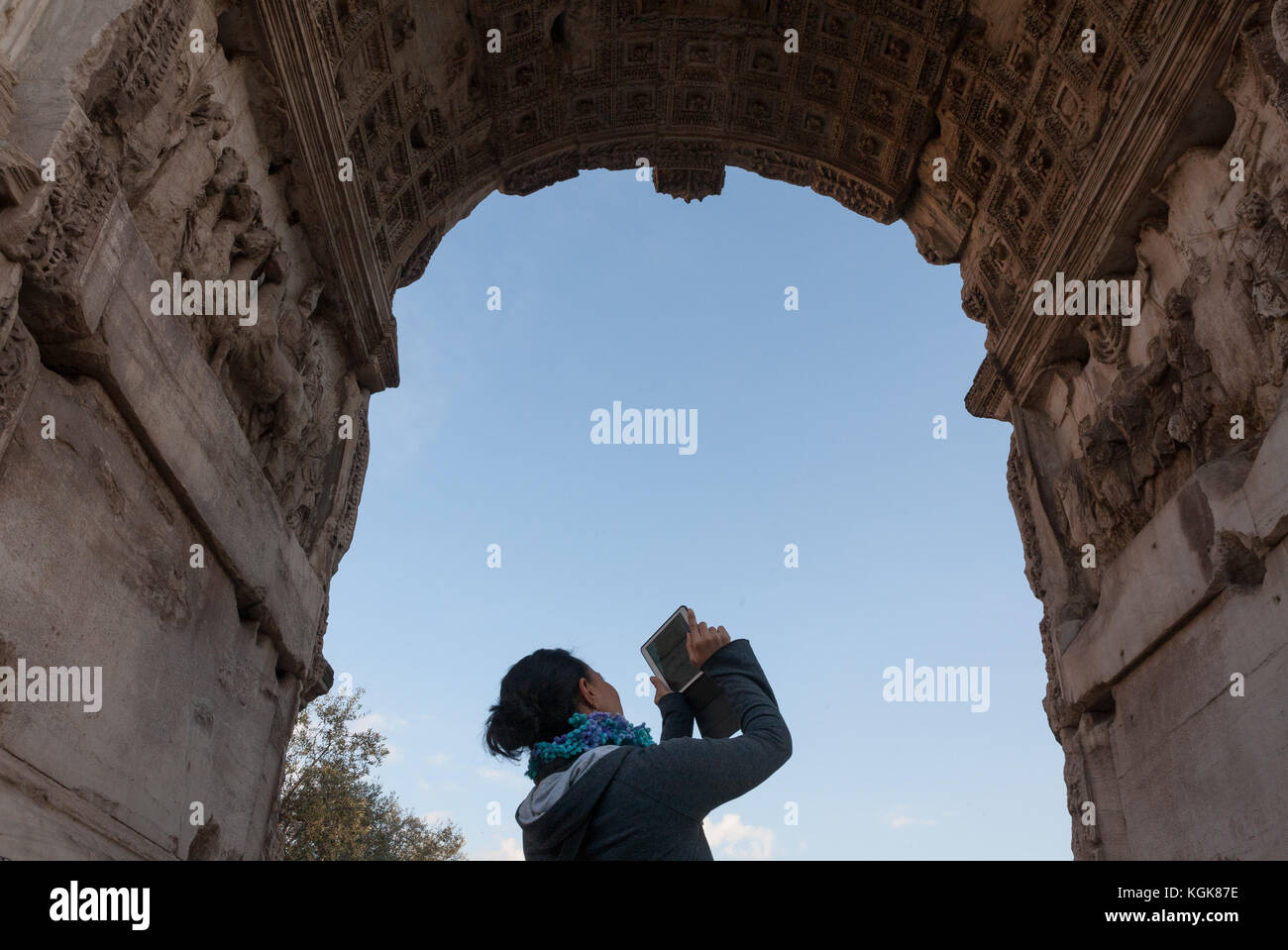 A tourist is taking a picture in the Roman Forum, Rome, Italy. Stock Photo