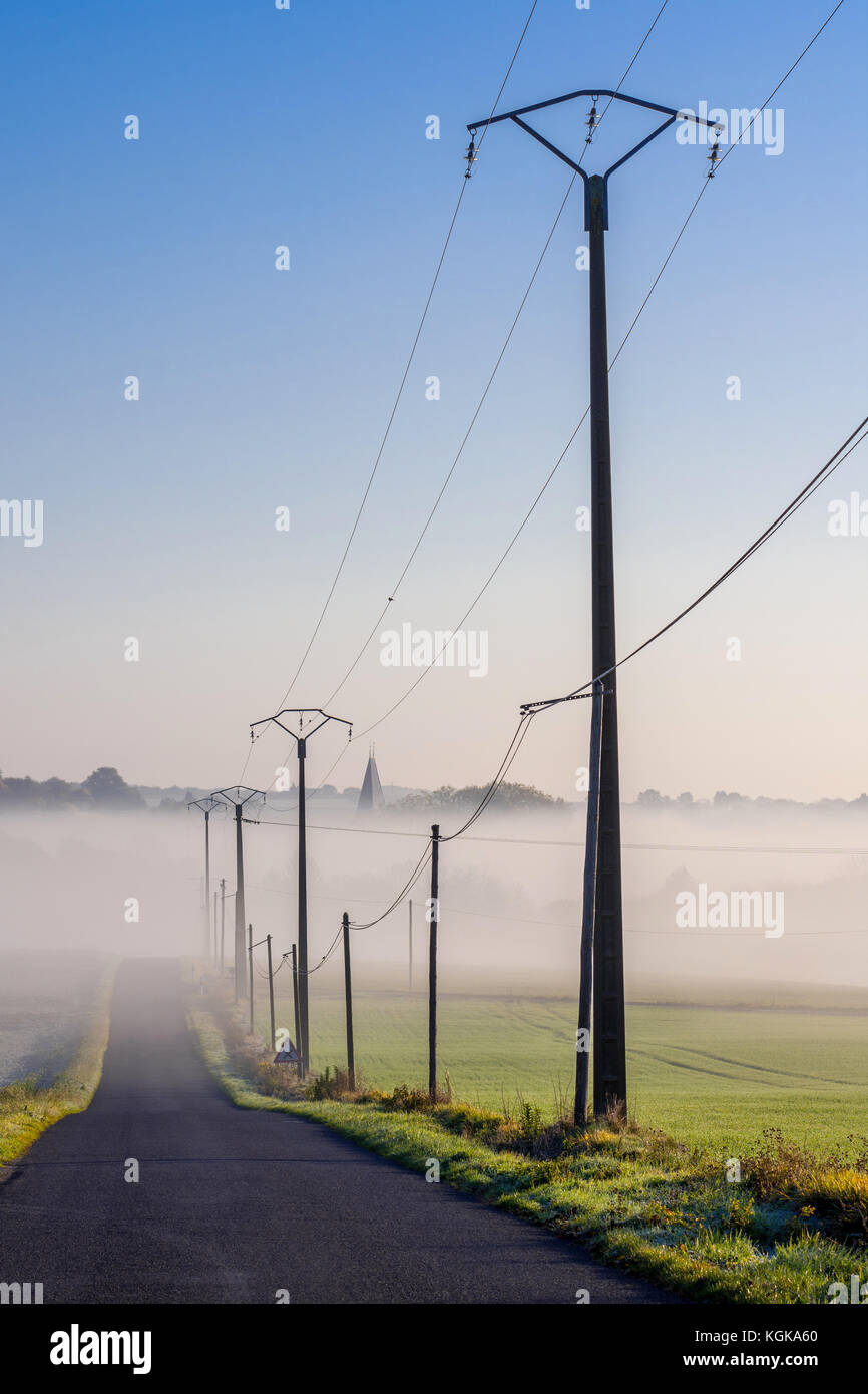 Electricity power lines alongside country road France Stock Photo Alamy