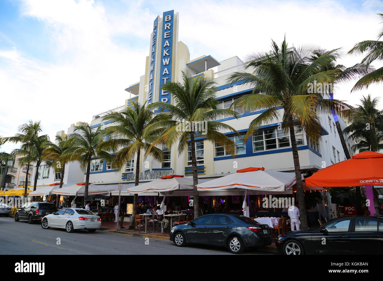 View of the Breakwater Hotel, an Art Deco building on Ocean Drive in South Beach, Miami, Florida, USA, with palm trees lining the front. Stock Photo