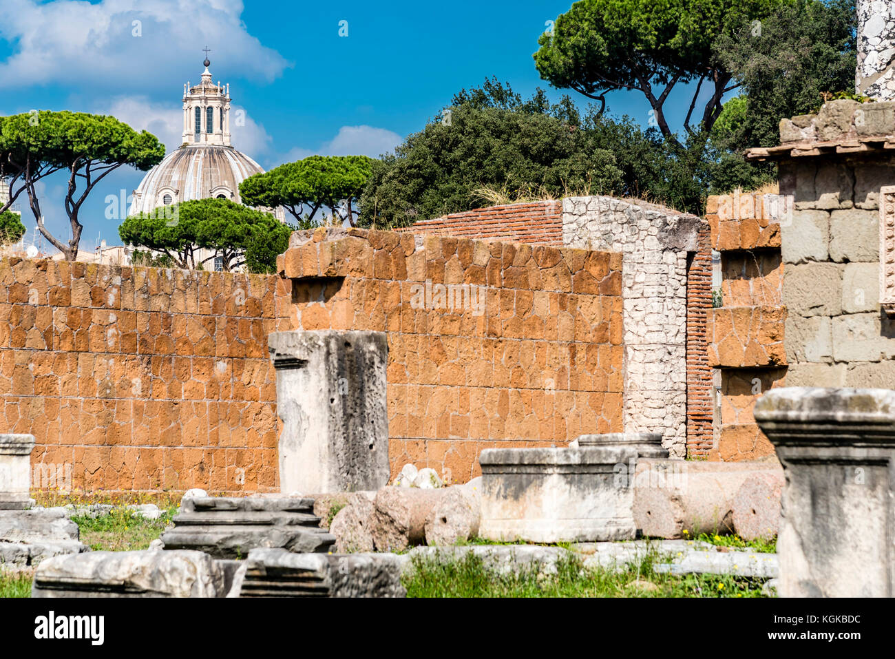 Remains of Basilica Aemilia, Roman Forum, Rome, Italy. Antique roman temple ruins, baroque church in background. Stock Photo