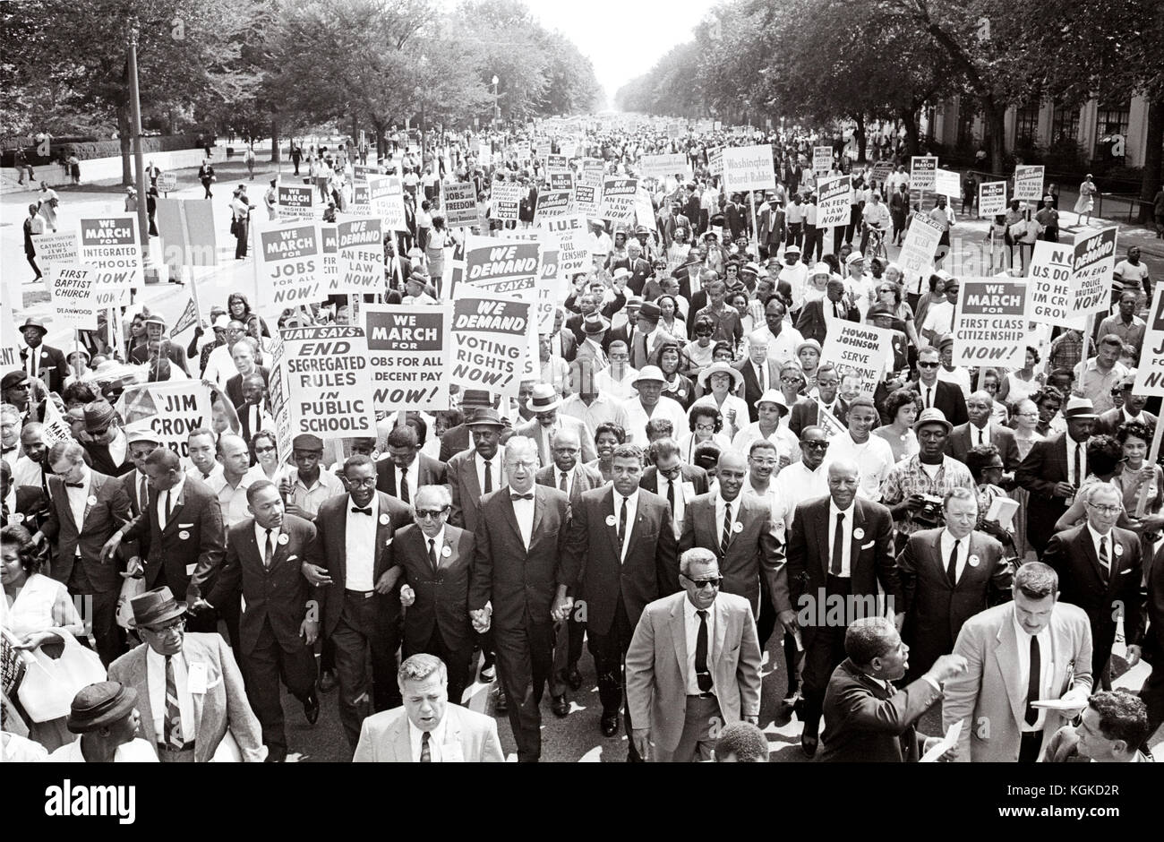 Leaders of the 1963 March on Washington for Jobs and Freedom hold hands as they lead a crowd of hundreds of thousands in Washington DC, August 28, 1963. Leaders in the front row include James Meredith, Dr. Martin Luther King, Jr., Rabbi Joachim Prinz,  Whitney Young, Roy Wilkins (light-colored suit);  A. Phillip Randolph; and Walter Reuther.  Credit: Arnie Sachs / CNP /MediaPunch Stock Photo