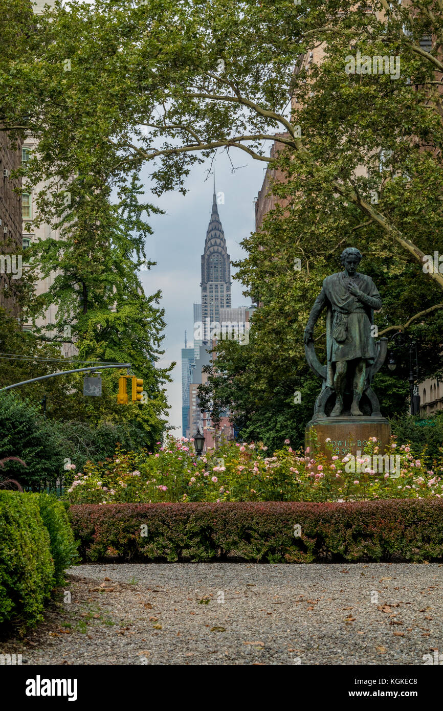 A statue of Edwin Booth as Hamlet in Gramercy Park (a private park in New York City) with the Chrysler building in the background. Stock Photo