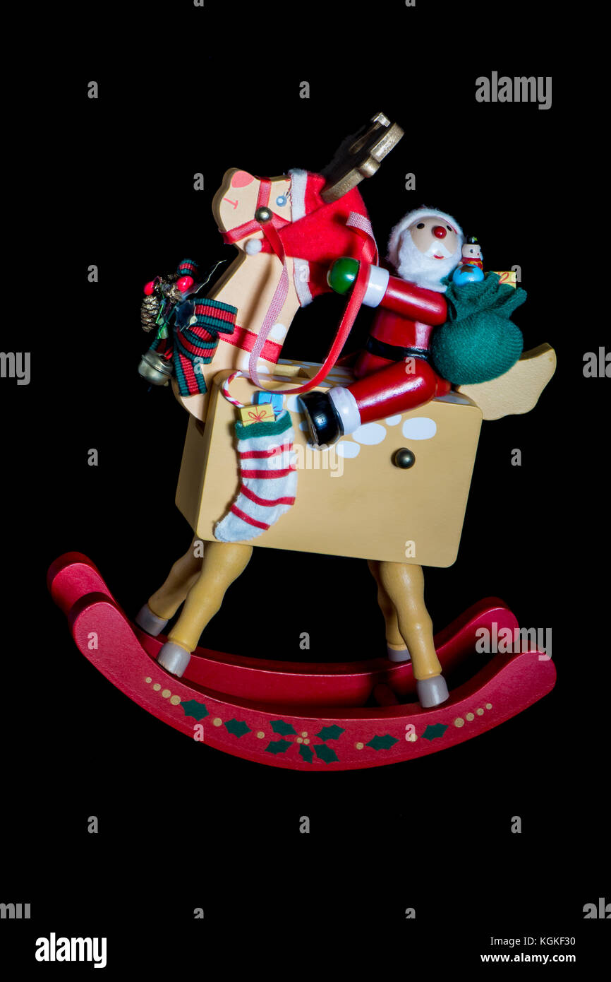 Christmas Decorations Depicting Santa Claus Riding His Rocking