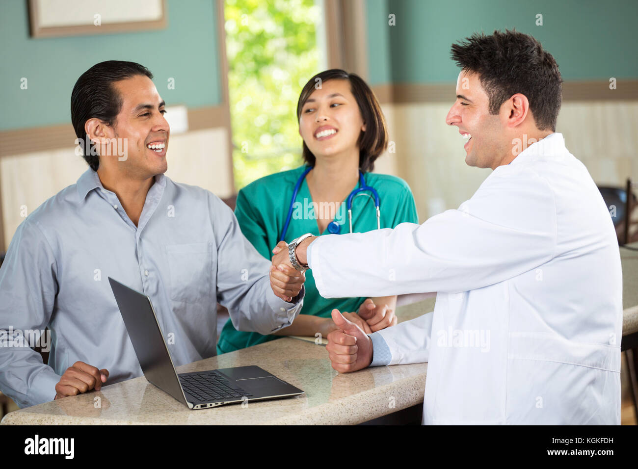Medical team talking with patients. Stock Photo