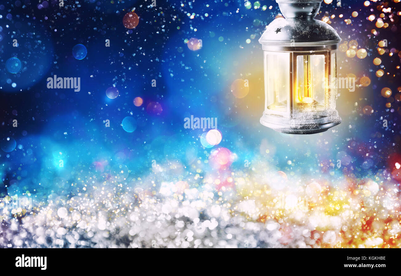 Shiny lantern on a Christmas background during the night Stock Photo