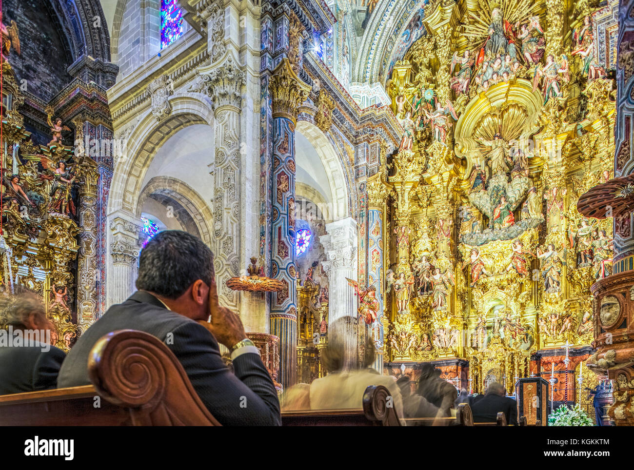 People attending Catholic mass, El Salvador church, Seville, Spain Stock Photo