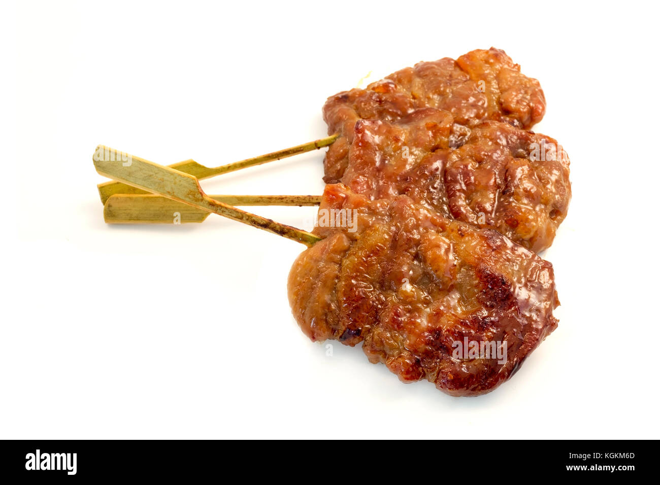 Moo Ping (Thai-style grilled pork on a skewer) on a white background Stock Photo