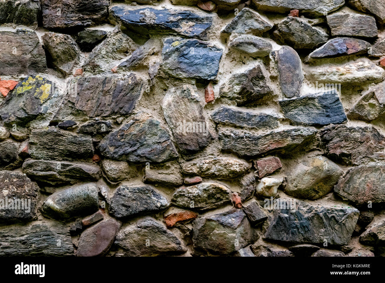 Medieval wall built of stone and bricks, background texture Stock Photo ...