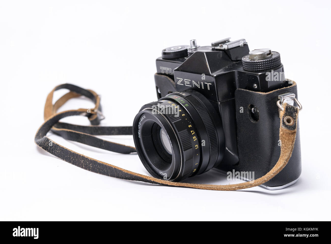 Old Soviet Zenit TLL 35 mm film camera isolated on white with Helios 44