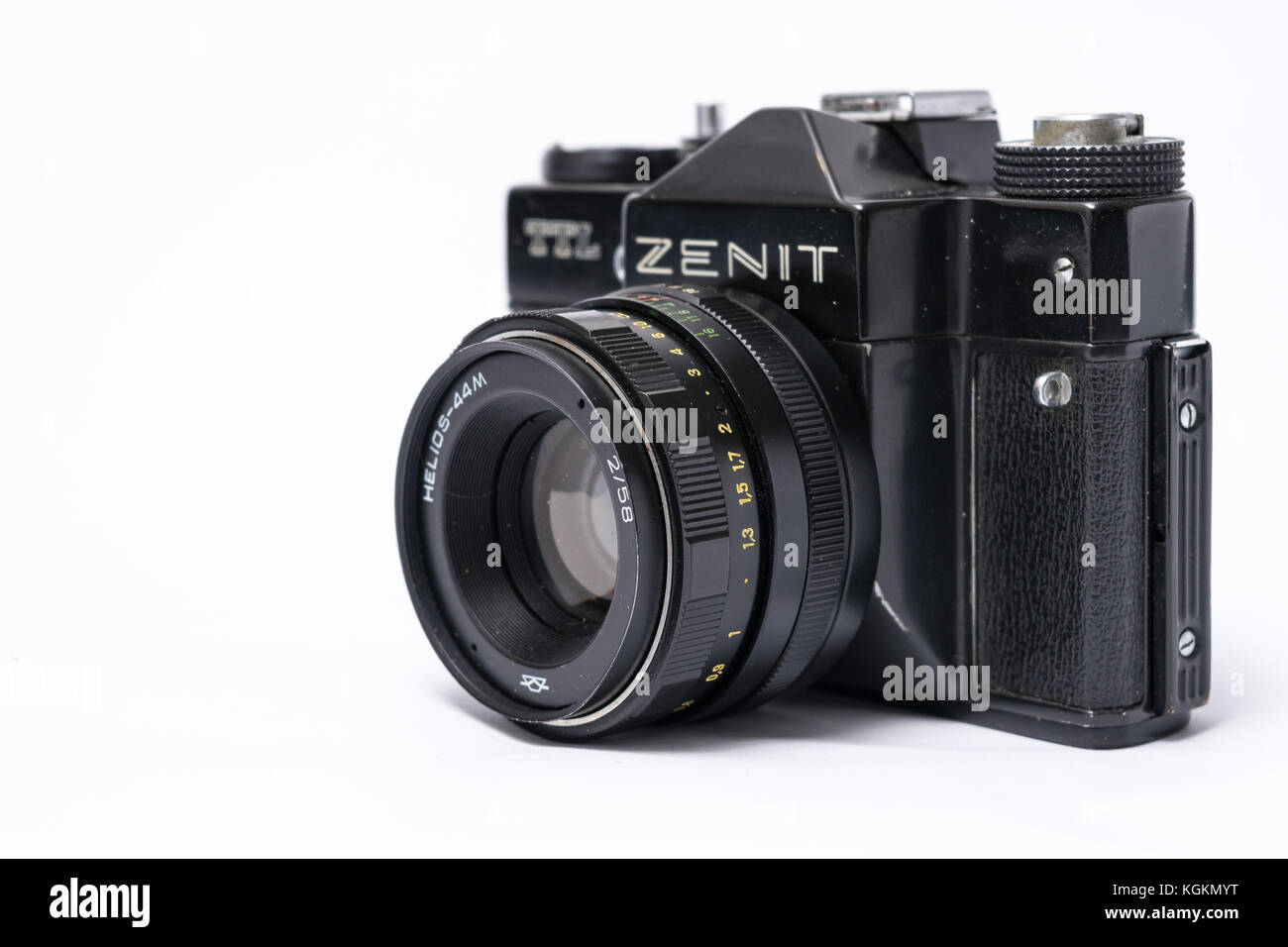 Old Soviet Zenit TLL 35 mm film camera isolated on white with Helios 44