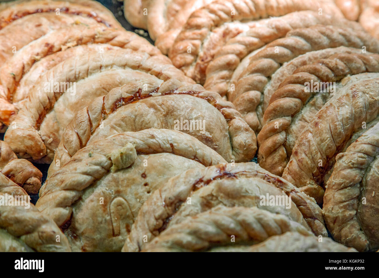 Many Traditional Cornish pasties in a shop display Stock Photo Alamy