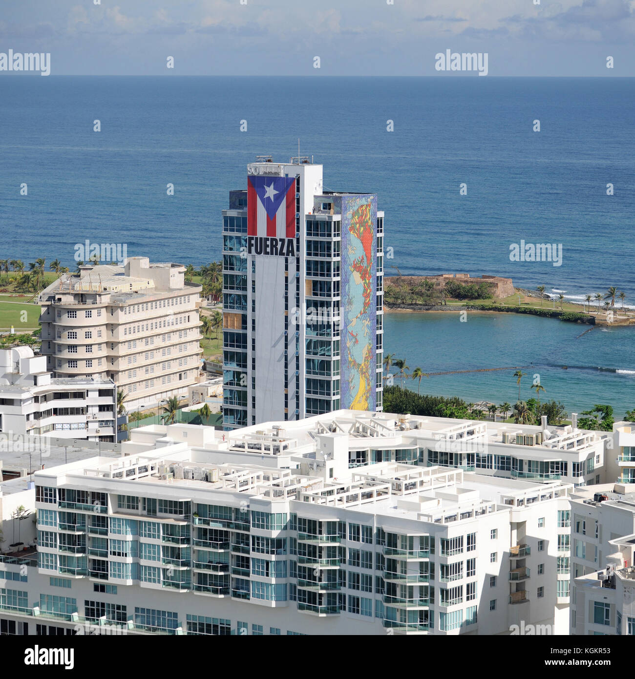 A large banner bearing the Puerto Rican flag and Spanish word for “strength” adorn San Juan’s El Caribe office building as vie Stock Photo