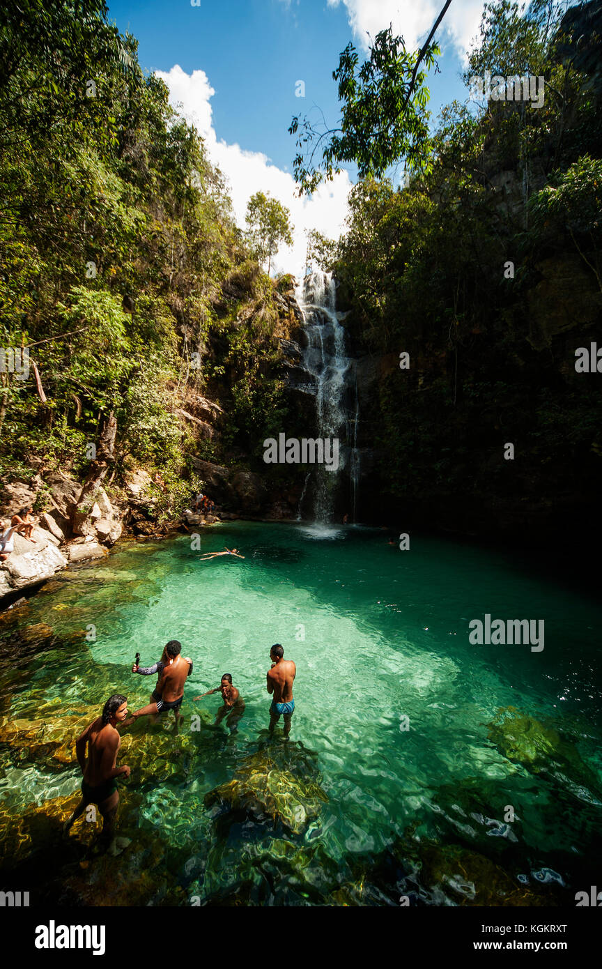 Tourists enjoying a swim at Santa Barbara waterfall, Chapada dos Veadeiros National Park, Goiás State, Brazil Stock Photo