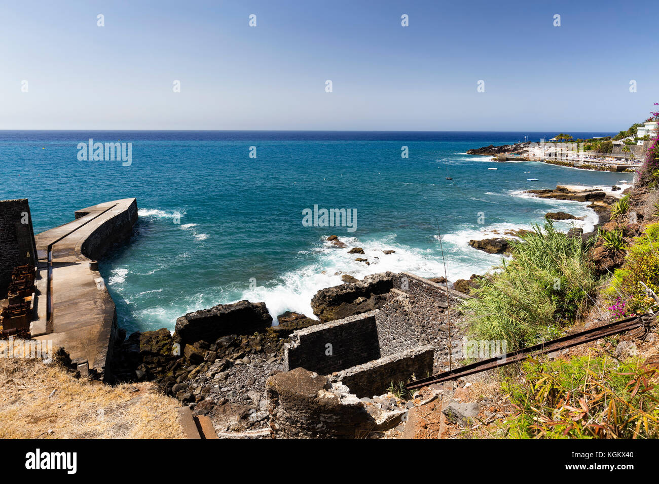 Pier and Abandoned houses next to the coast in Funchal on the Portuguese island of Madeira Stock