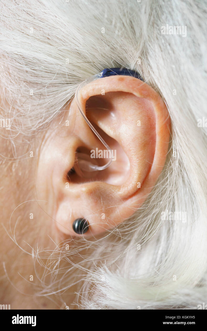 Close-up of senior woman's ear wearing hearing aid Stock Photo