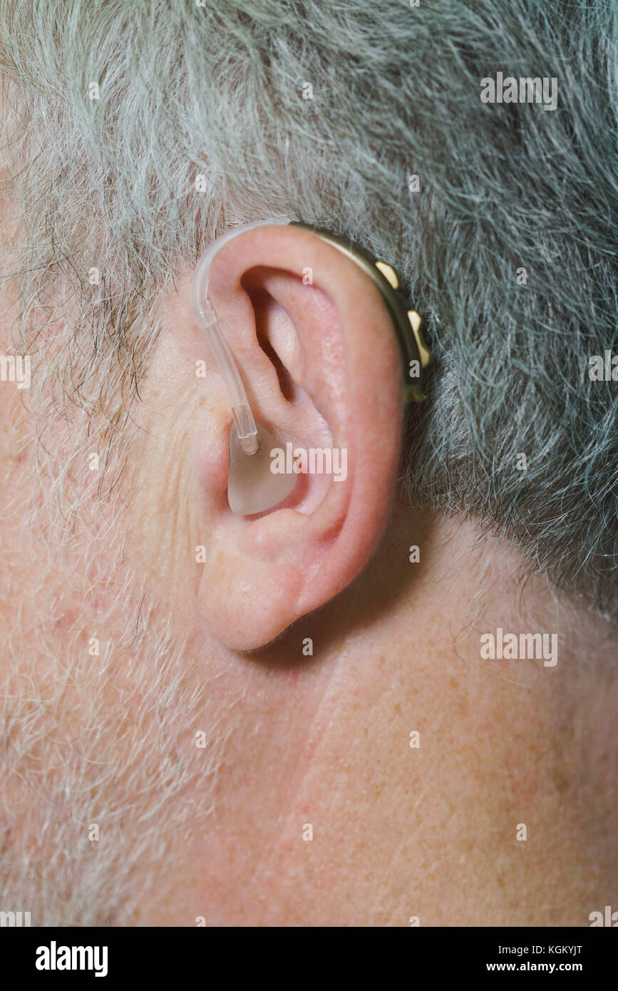 Cropped image of man wearing hearing aid Stock Photo