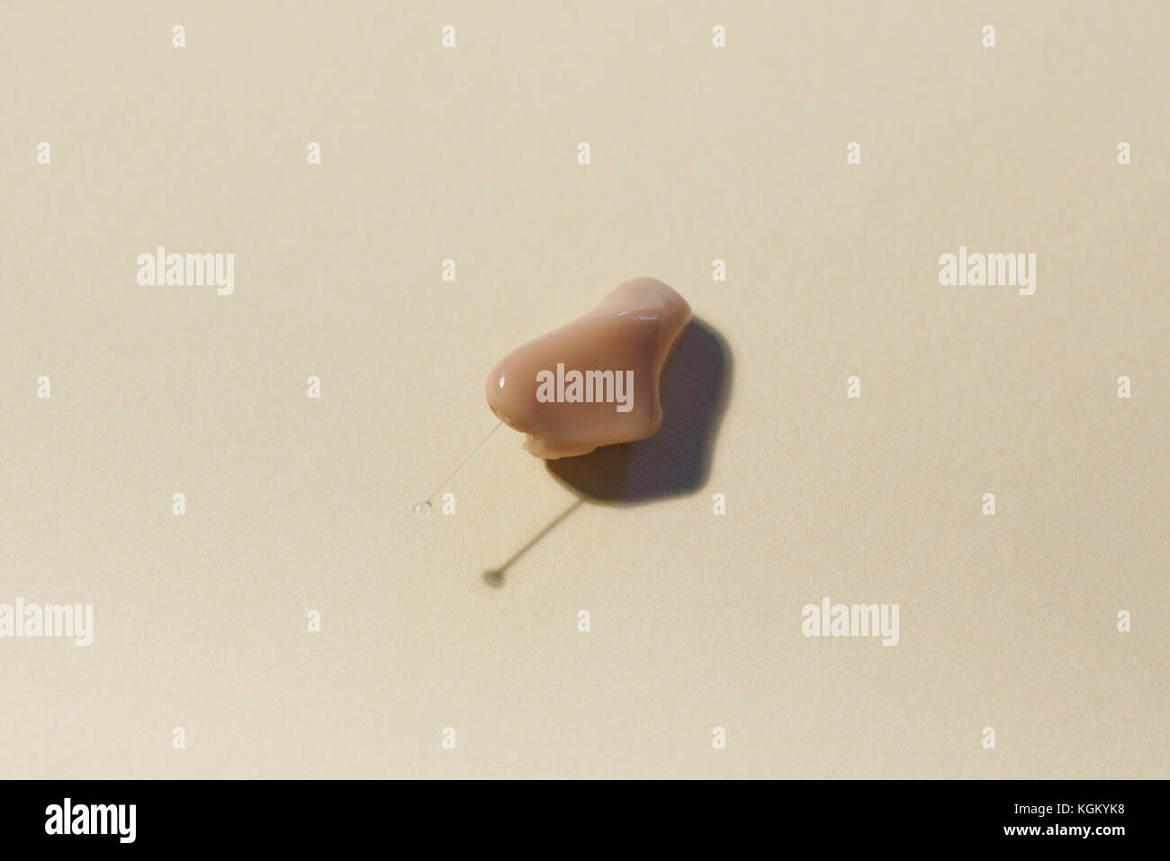 High angle view of hearing aid on table Stock Photo