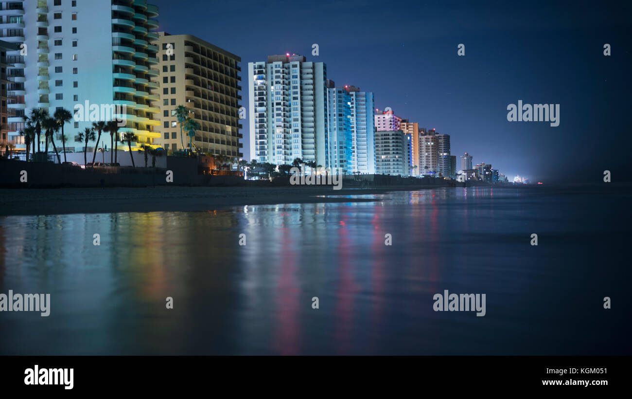 Illuminated buildings by beach in city at night, Daytona, Florida, USA Stock Photo