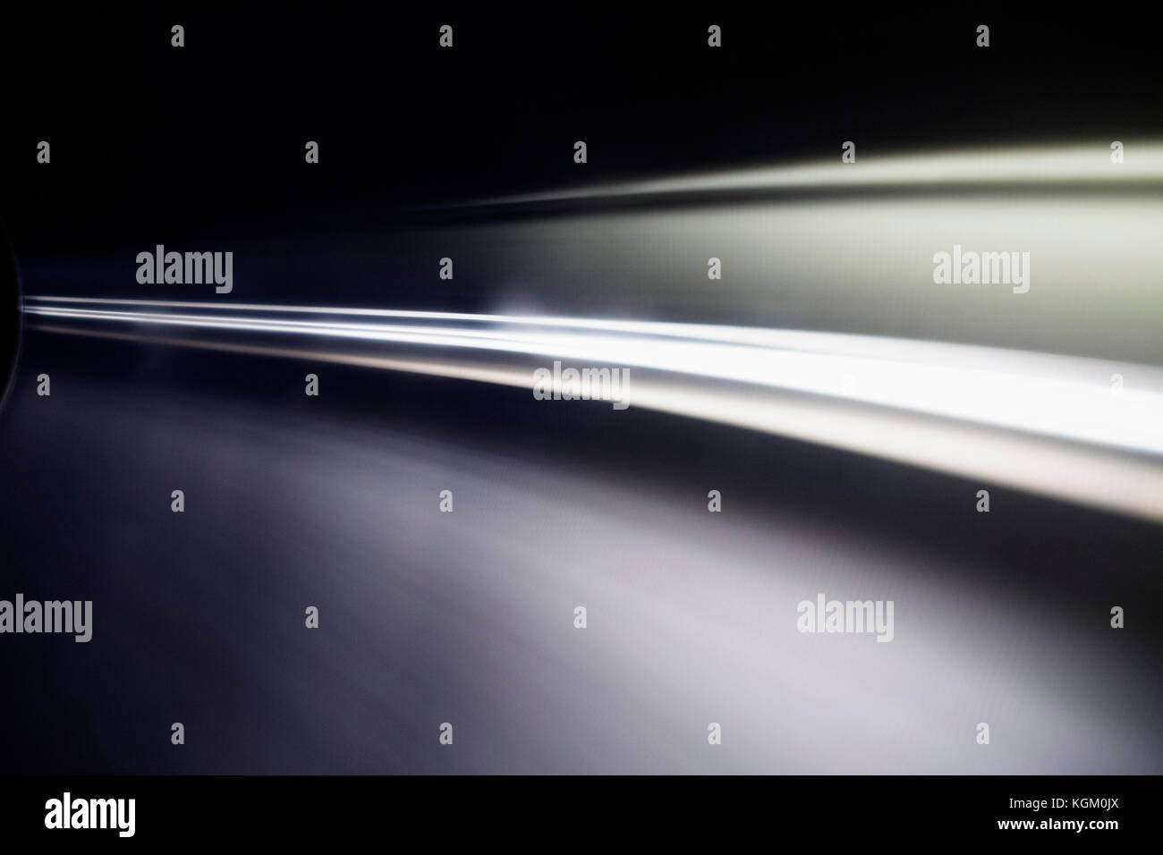 Abstract light trails against black background Stock Photo - Alamy