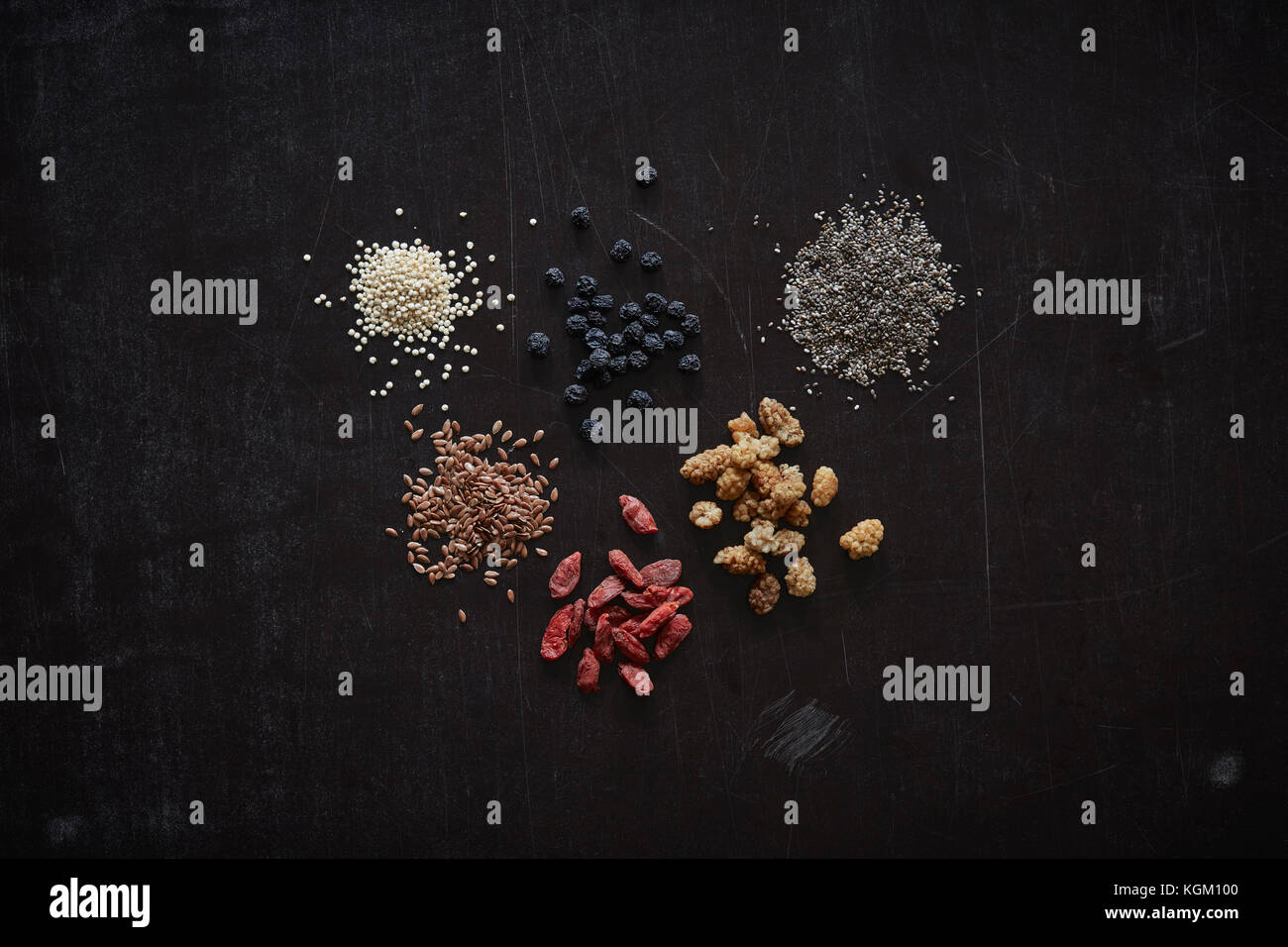 Directly above shot of various dried food arranged on granite Stock Photo