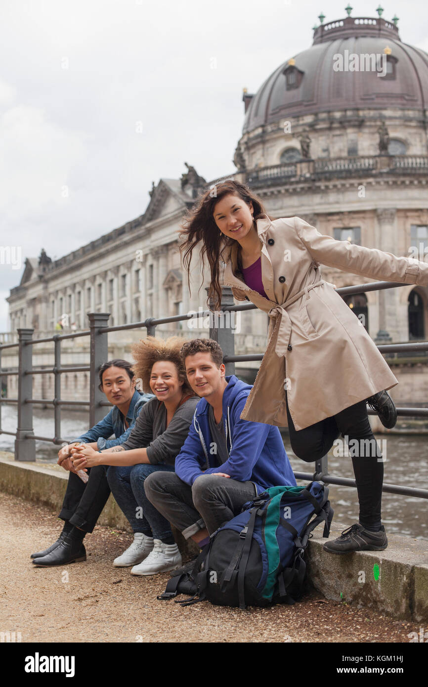Portrait of young multi-ethnic friends against Bode Museum, Berlin, Germany Stock Photo