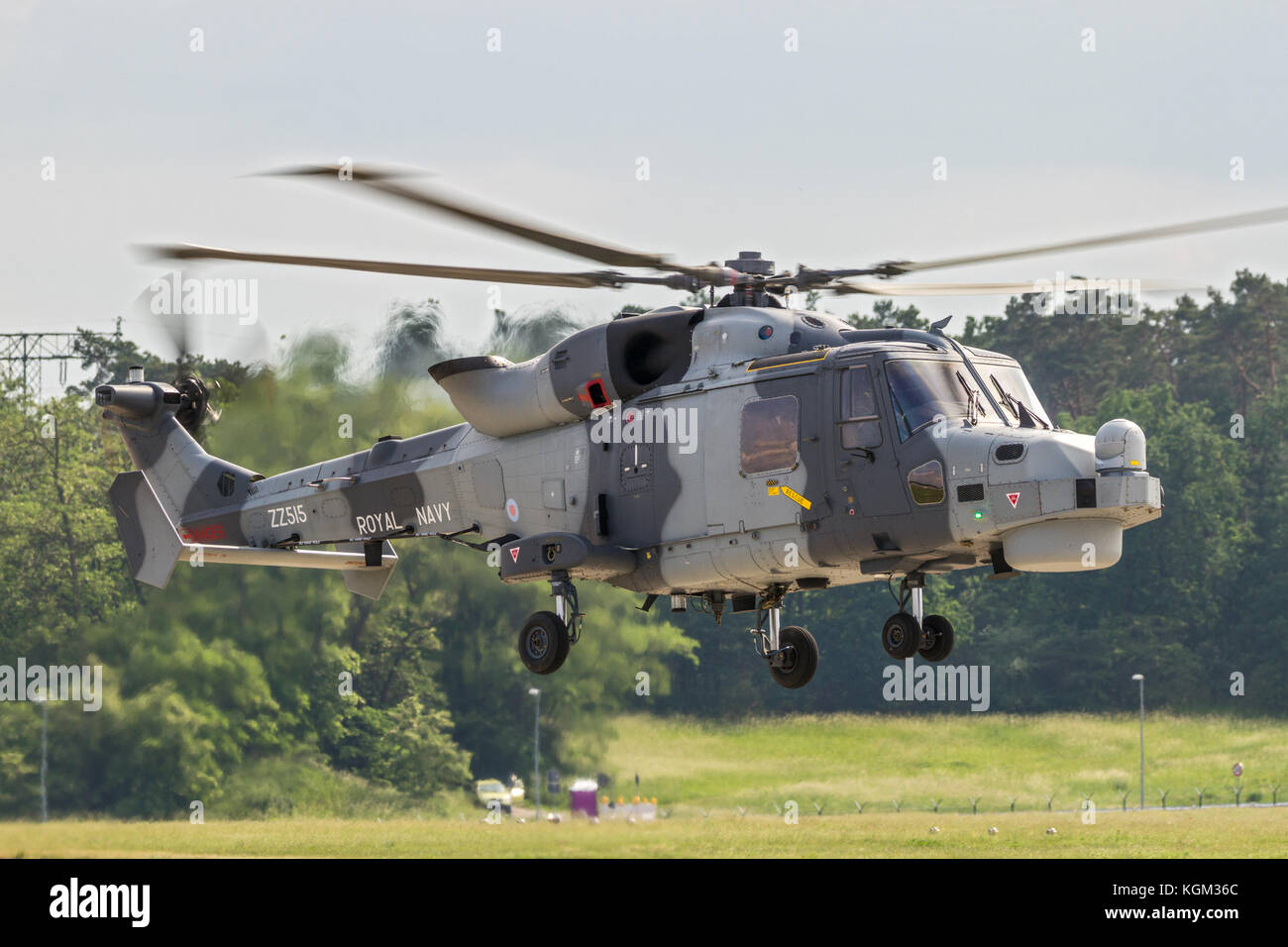 BERLIN - JUN 2, 2016: Royal Navy Wildcat helicopter about to land at Berlin-Schoneveld airport. Stock Photo