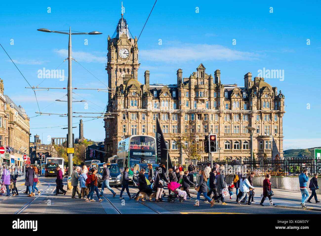 View along Princes street to the  Balmoral Hotel with busy pedestrian crossing Edinburgh , Scotland, United Kingdom. Stock Photo
