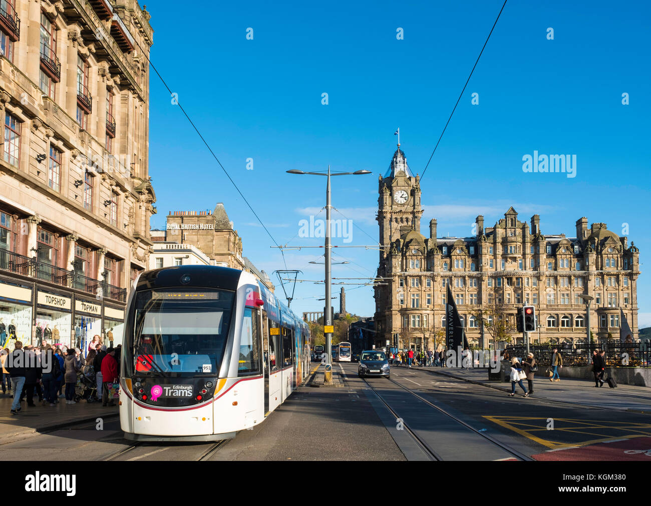 View along Princes street with tram and Balmoral Hotel visible in Edinburgh , Scotland, United Kingdom. Stock Photo