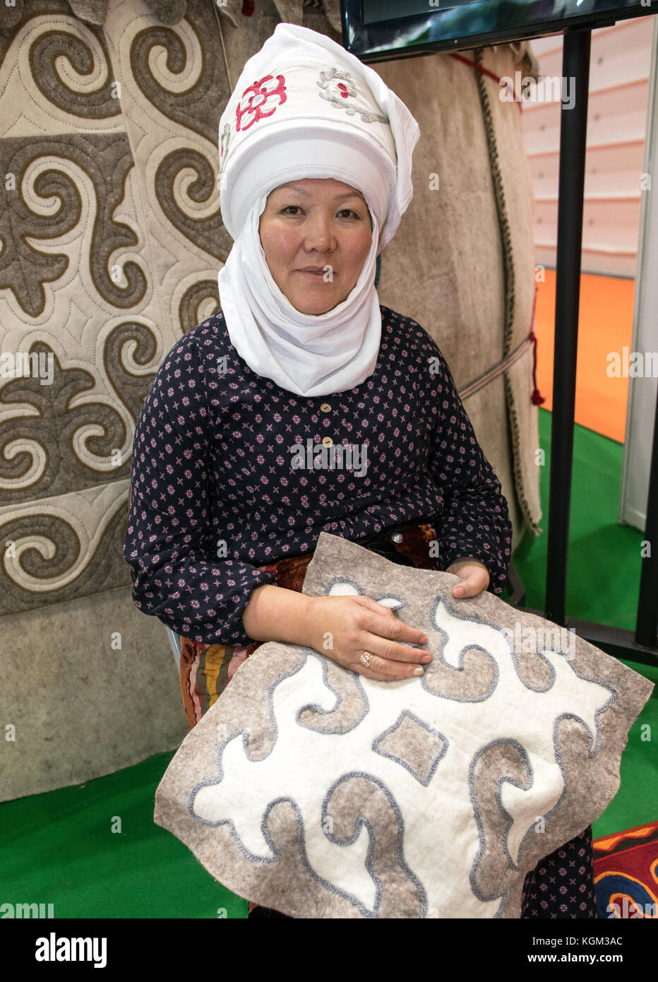 Woman sitting Inside a Yurt In Kyrgyzstan Stock Photo