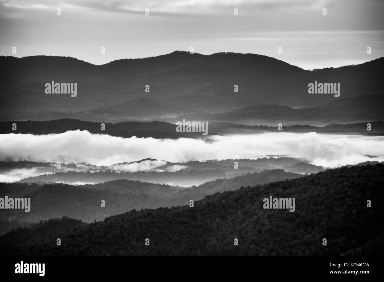 Monochrome view across Blue Ridge mountains at sunrise with fog in the valleys. Stock Photo