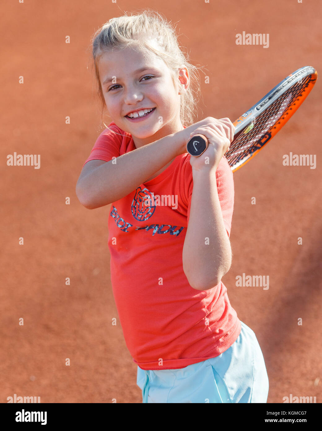 young girl (8)0 playing tennis Stock Photo