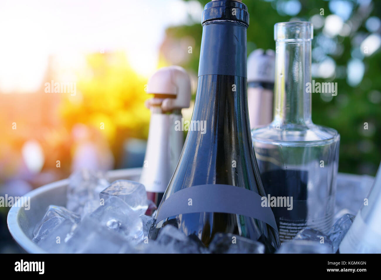 Wine bottles set in bucket, NYC rooftop Stock Photo Alamy