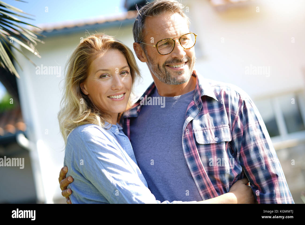 Portrait of mature couple relaxing in outdoor sofa Stock Photo
