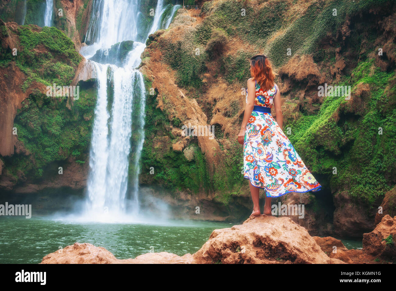 Girl In Front Of A Waterfall Stock Photo - Alamy