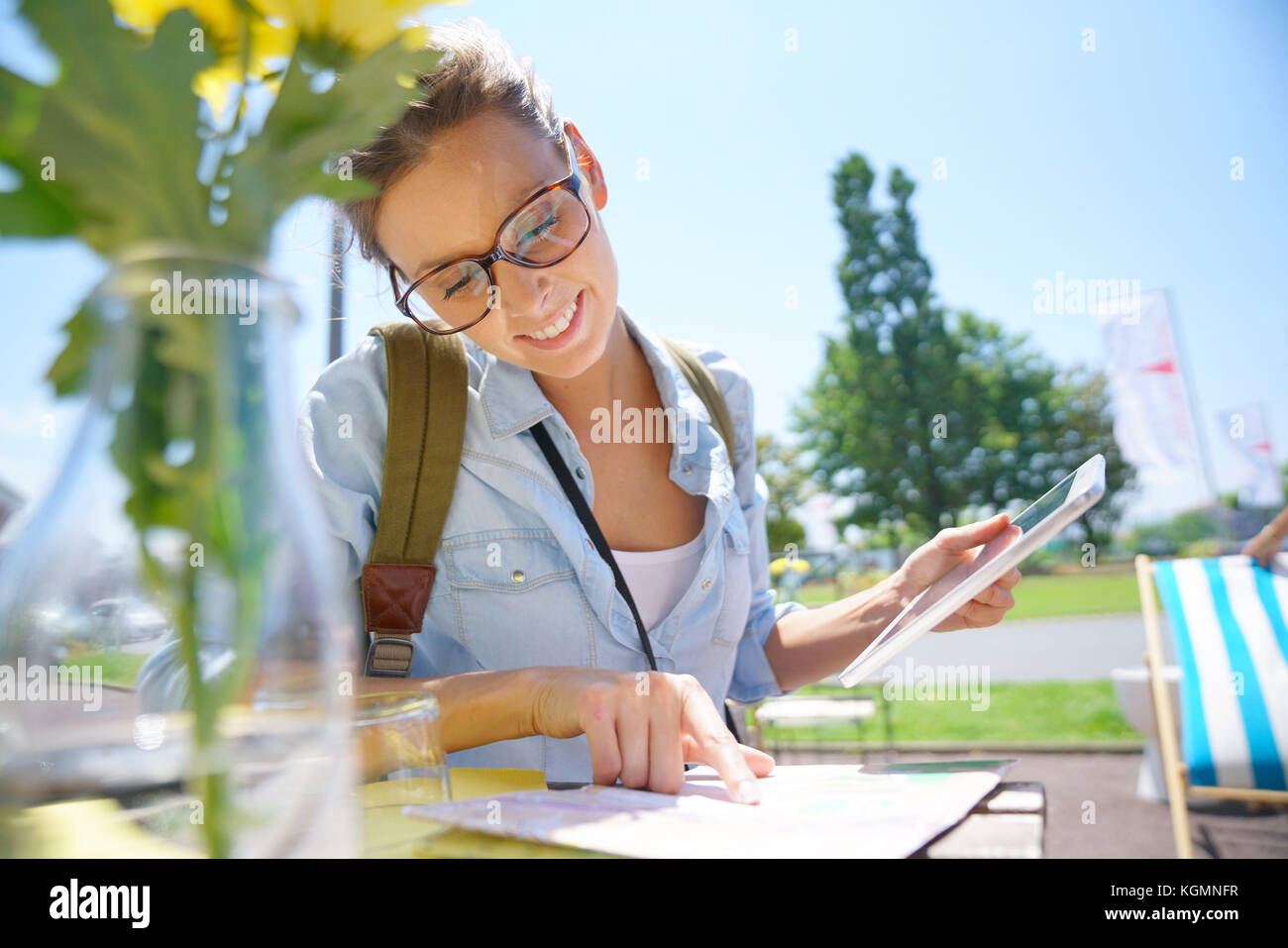 Globetrotter reading city map at coffee shop table Stock Photo