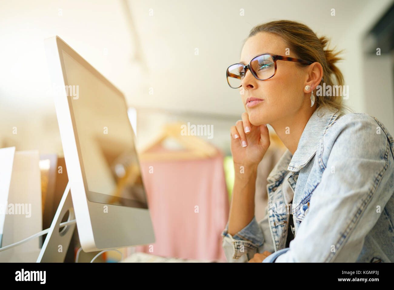Garments Computer Work Fashion designer working on computer in workshop Stock Photo - Alamy