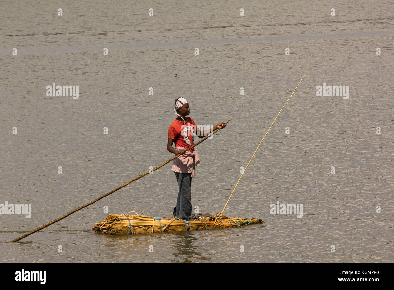 Fisherman floating on traditional reed raft. Different types of rafts