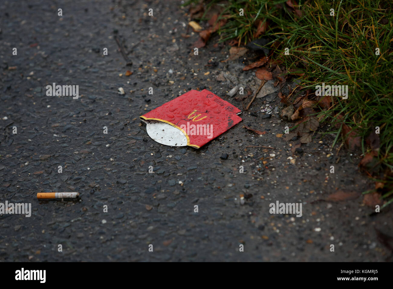 Empty coffee cups pictured littering the streets and roadside in UK. Stock Photo