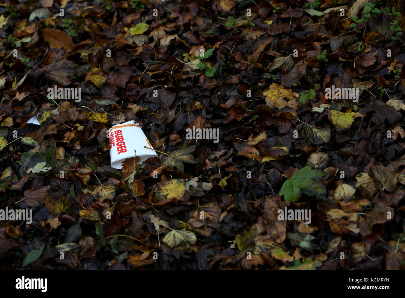 Empty coffee cups pictured littering the streets and roadside in UK. Stock Photo