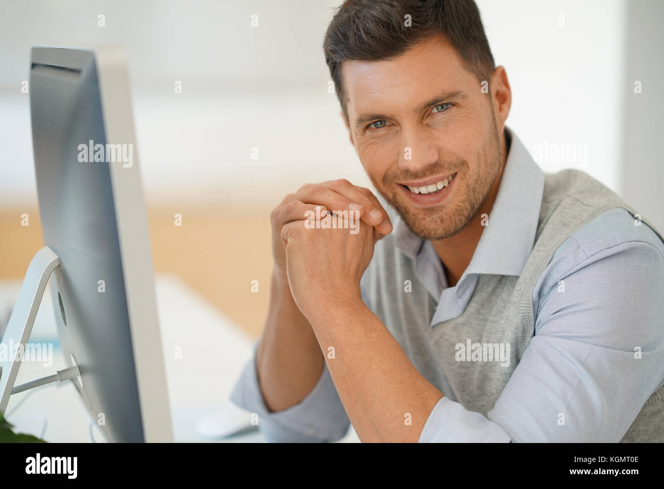 Handsome businessman working for startup company Stock Photo - Alamy