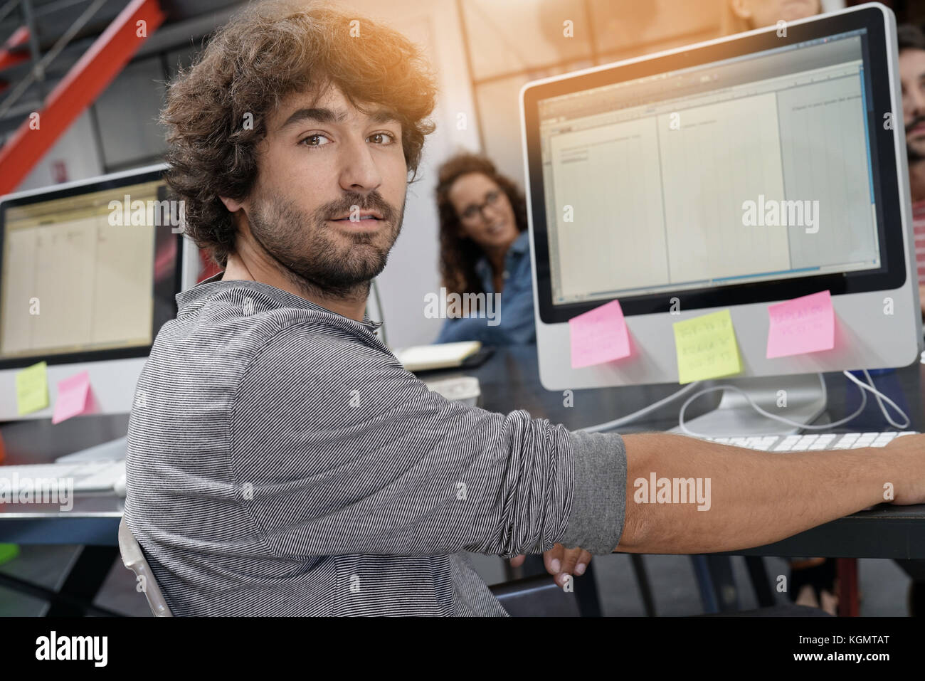 Startup entrepreneur working on desktop in office Stock Photo - Alamy