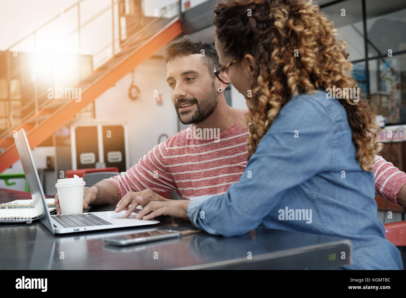 Start-up people working on laptop in office Stock Photo - Alamy