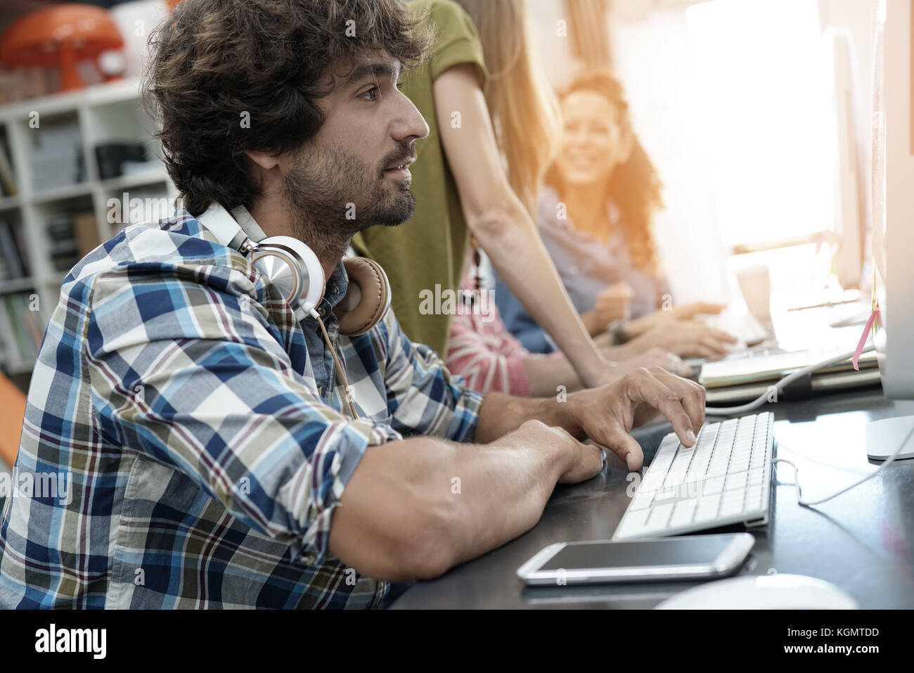Startup entrepreneur working on desktop in office Stock Photo - Alamy