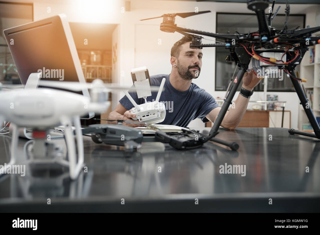 Engineer working on drone in office Stock Photo - Alamy