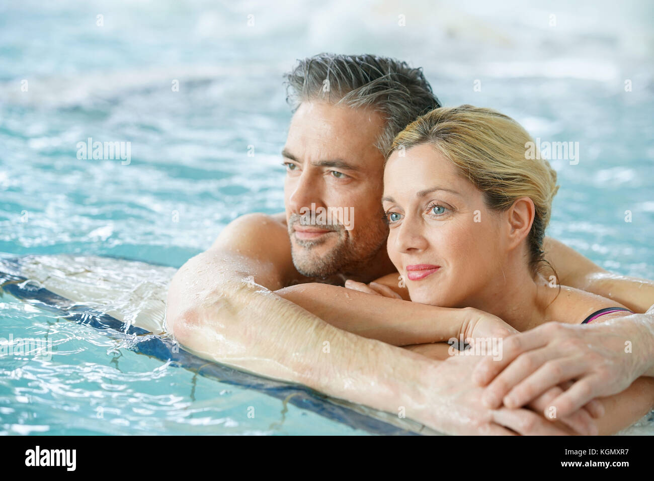Young couple splashing in swimming pool | Swimming pool photography, Pool  photography, Pool poses